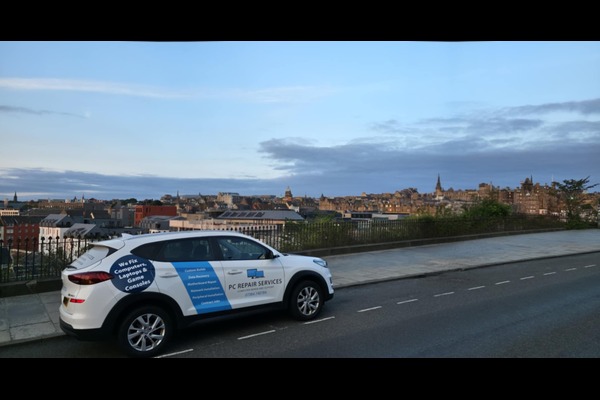 PC Repair Services branded vehicle with Edinburgh skyline